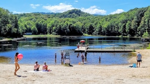 Just minutes from Sugar Mountain, Wildcat Lake offers swimming, fishing, and a sandy beach perfect for a relaxing summer afternoon. - Creekside Sugar Mountain Cabin with Fireplace (Sugar Mountain)
