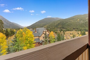 A mountain cabin with a view of a forested valley and distant mountains. - Slopeside Luxury at Red Hawk Lodge – Walk to Keystone Gondola (Keystone)