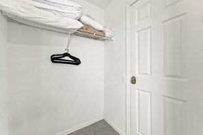 A white door with a keyhole and a small switch on the wall. - 3BR/3BA Kissimmee Townhome, Private Pool, Near Disney (Kissimmee)