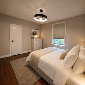 A bedroom with a bed, a dresser, a framed picture, a window with blinds, and a ceiling light. - Modern 4BR Home | Subway | Parking | Toronto (Toronto)