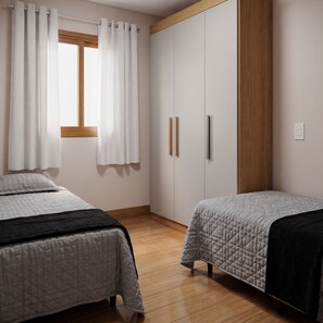Ein Schlafzimmer mit zwei Betten, einem fensterbelaubten Fenster, einem Kleiderschrank und Holzboden.