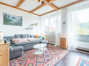 A modern living room with a grey sofa, a glass coffee table, and a colorful rug. - Apartment Stephi by Interhome (Neukirchen beim Heiligen Blut)