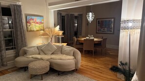 A cozy living room with a sectional sofa, a dining table, and chairs. - Stunning Victorian home with easy access to the best of Boulder - and Sundance! (Boulder)