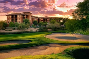 A golf course with bunkers and a building in the background. - Westin Kierland Villas · 2BR Sleeps 8 · Golf Views, Pools & Resort Amenities (Scottsdale)