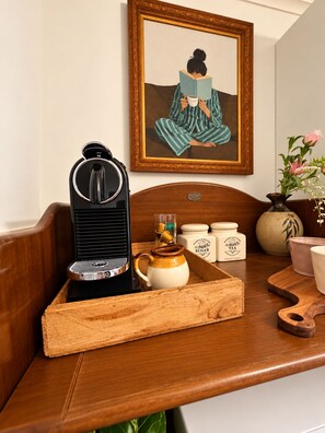 A wooden tray with a coffee machine, a teapot, and sugar and tea containers on a table. - Entire 3BR Beachside House in the Heart of St Kilda (St Kilda)