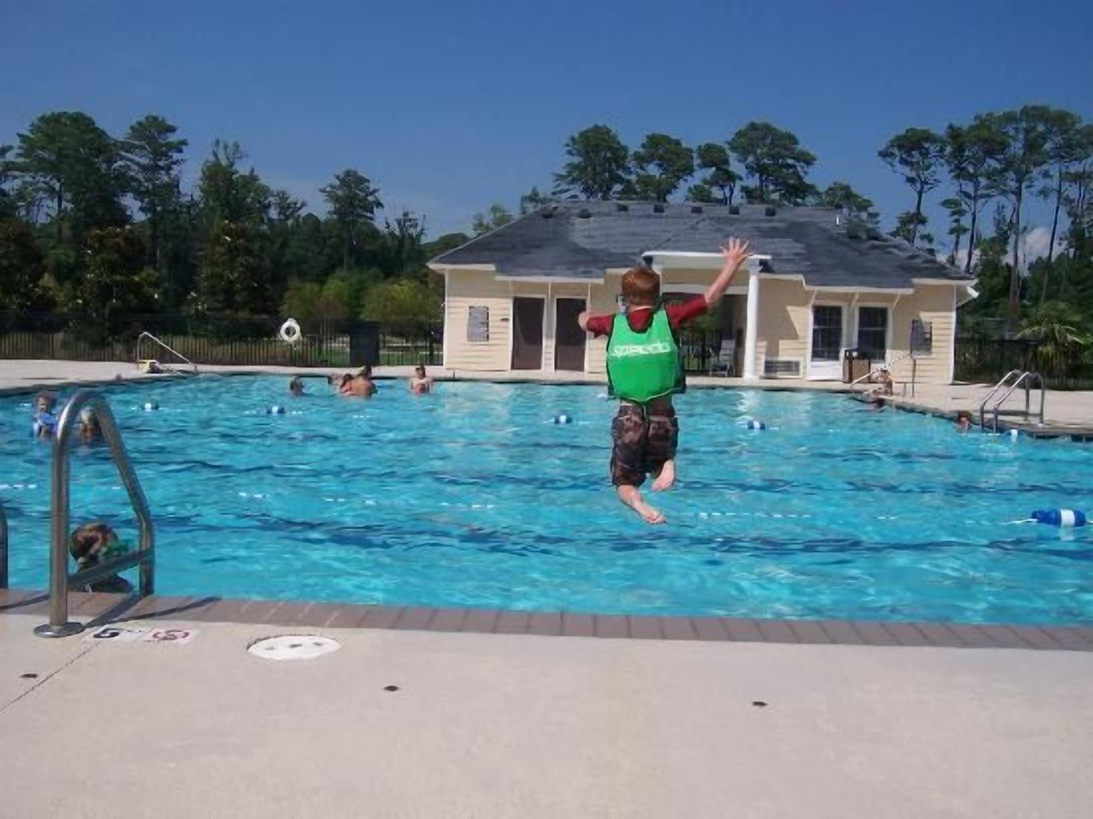 Sunny resort-style pool with clubhouse and plenty of space to unwind