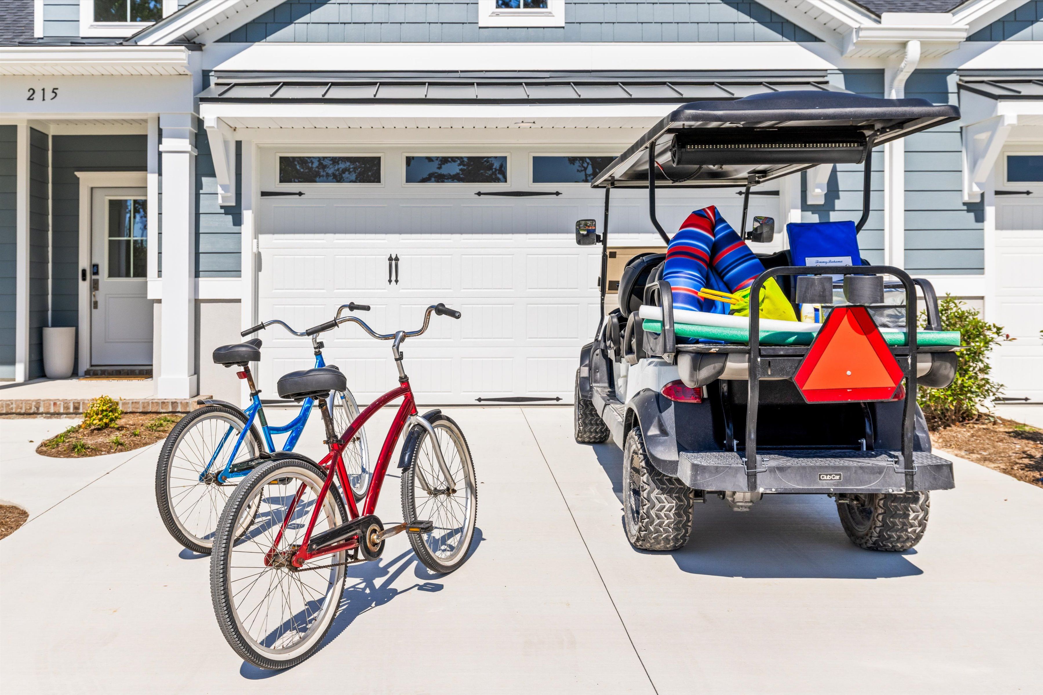 Cruiser bikes and a golf cart ready for beach days and neighborhood fun