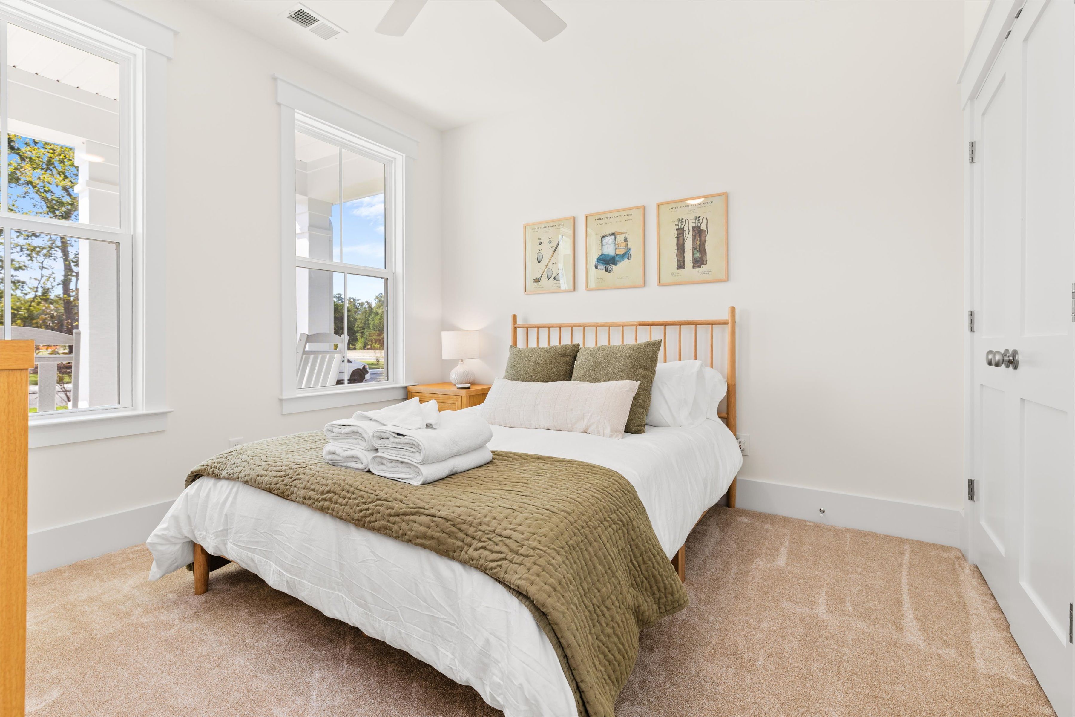 Bright, cozy bedroom with natural light and serene, welcoming decor