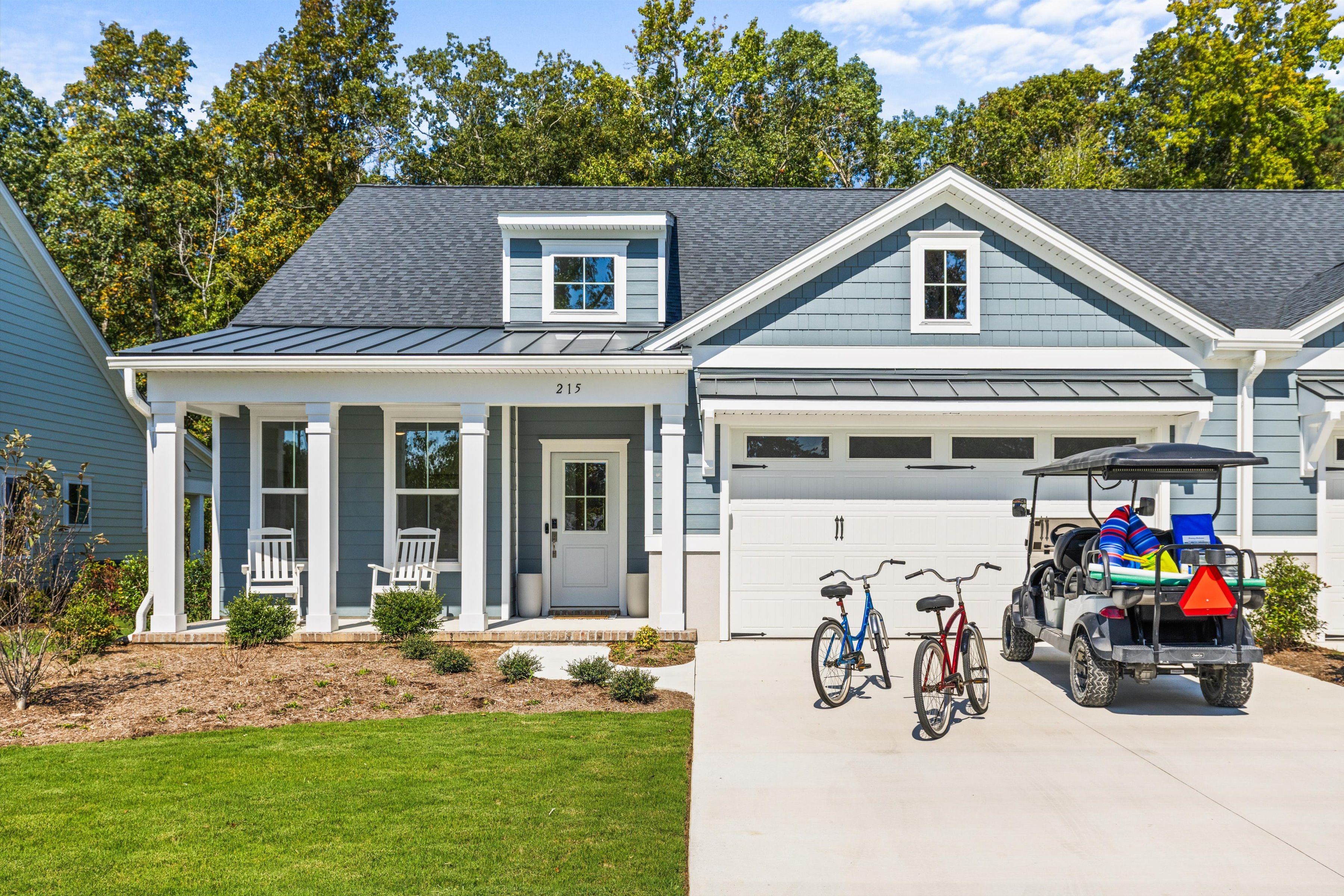 Charming coastal home with porch, bikes, and golf cart included