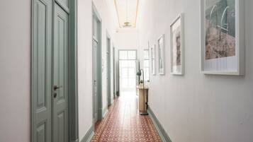 Bright hallway with vintage tile floors and elegant period charm