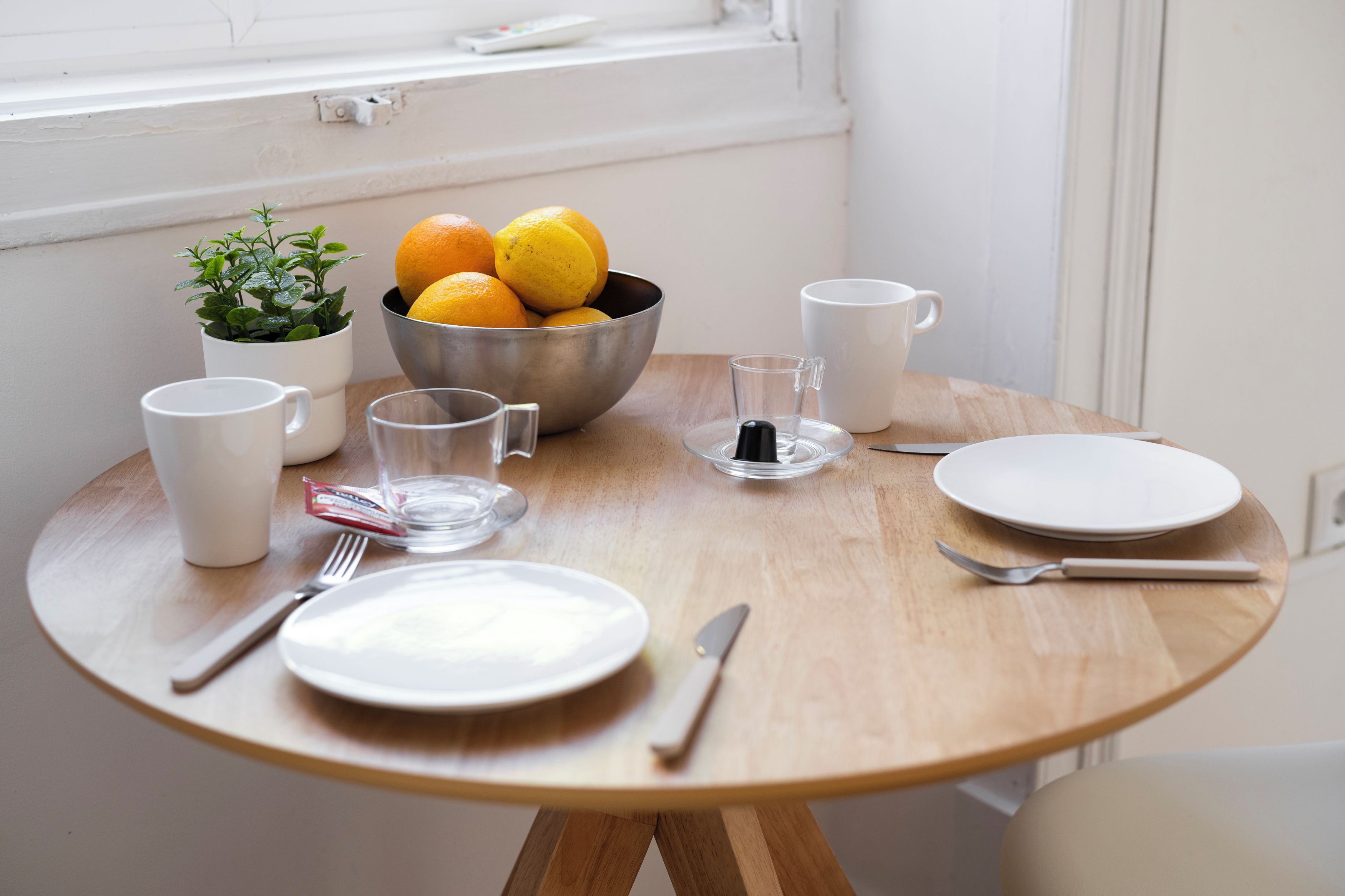 Bright breakfast nook with fresh citrus and cozy window-side seating