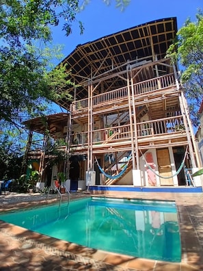 A multi-story building with a pool, surrounded by trees. - House With Private Pool and bbq (Santa Marta)