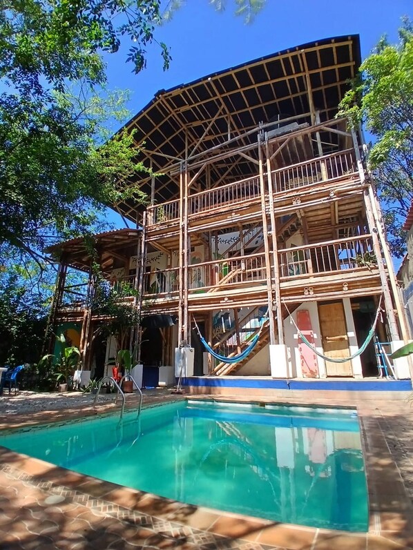 A multi-story building with a pool, surrounded by trees. - House With Private Pool and bbq (Santa Marta)