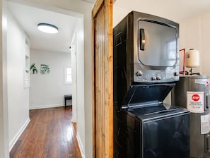 A compact kitchen with a built-in oven and a water heater. - Costy Stay | 8 minutes to Downtown & Broadway | Free Parking (Nashville)