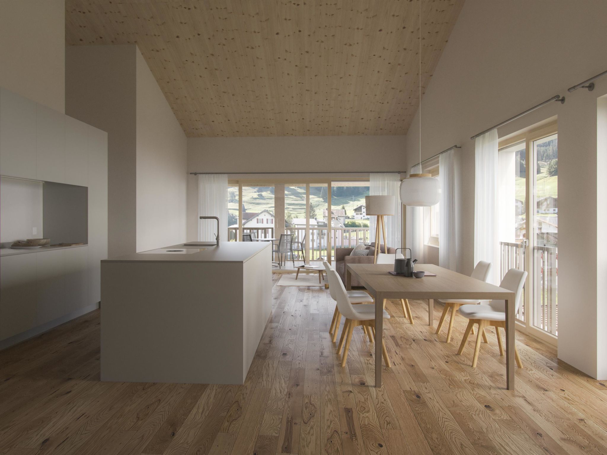 A spacious kitchen with a central island, wooden flooring, and large windows offering a view of the countryside.