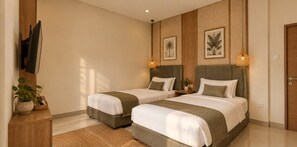 A hotel room with two beds, a wooden cabinet, a television, and wall-mounted artwork. - Awi House (Jimbaran)