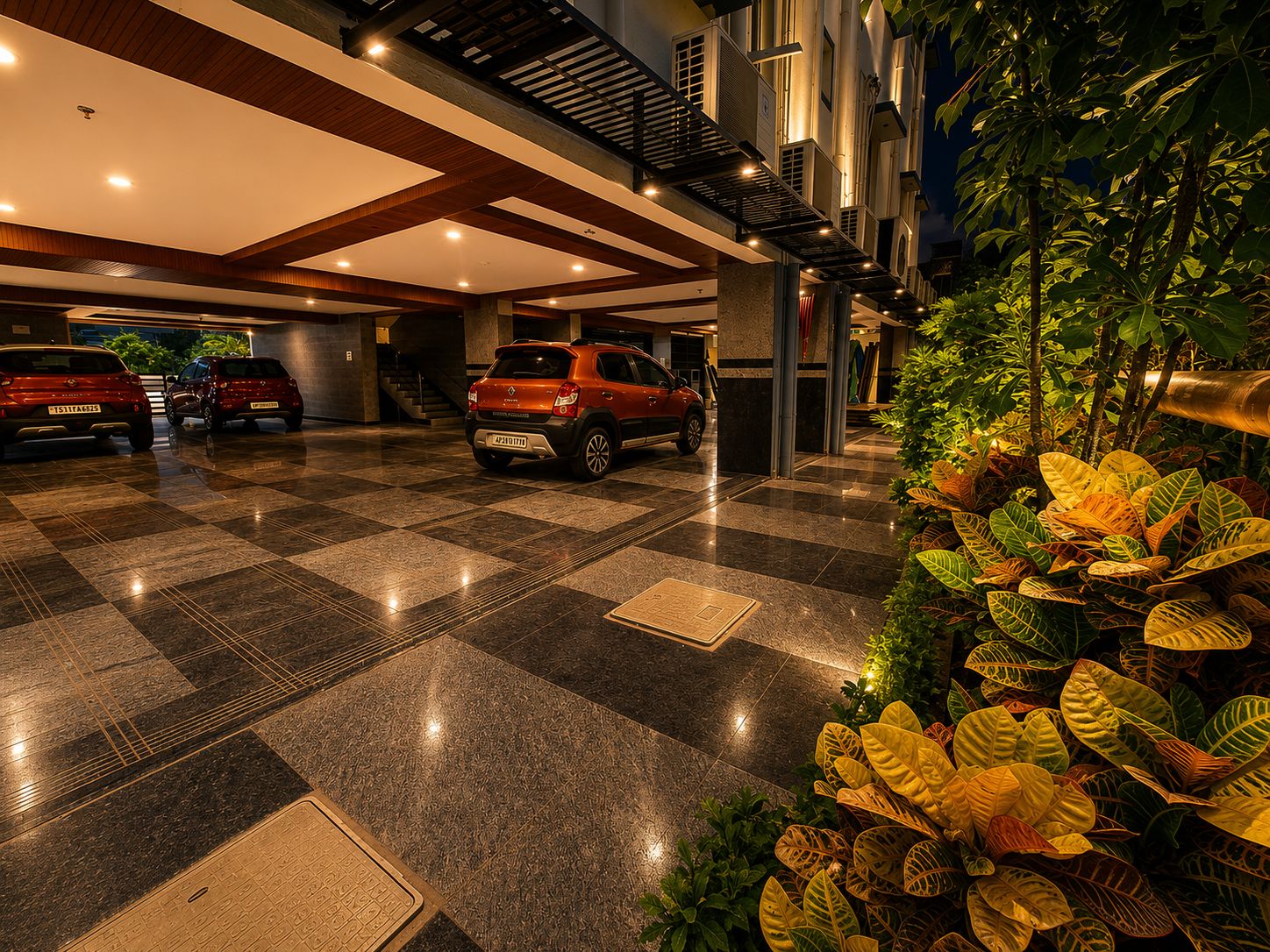 A parking area with multiple cars, a checkered floor, and a decorative plant arrangement.