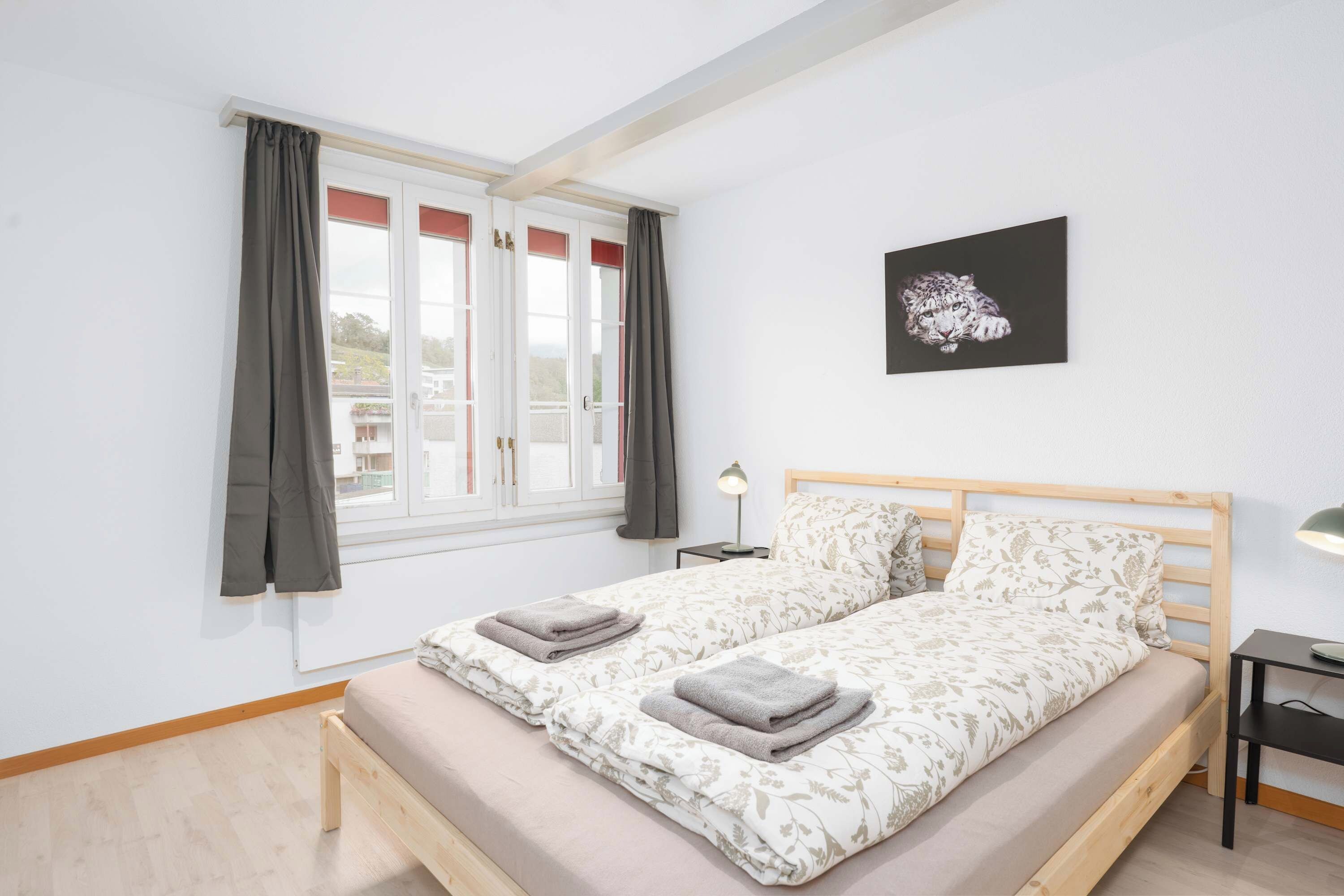Cozy bedroom with a double bed and plenty of natural light.