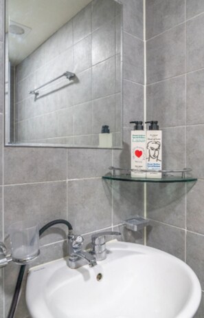 A bathroom with a white sink, a glass shelf, and a mirror. - 1-Min Walk to Shinnonhyeon Station - GANGNAM Lovely Studio - #Modern #Travel (Seoul)