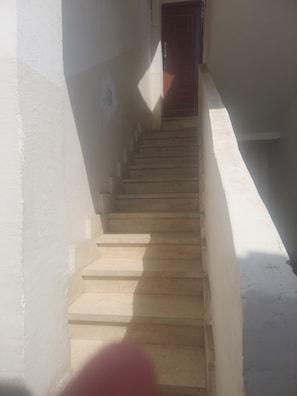 A staircase leading to a door. - Number Pyramids (Cairo)