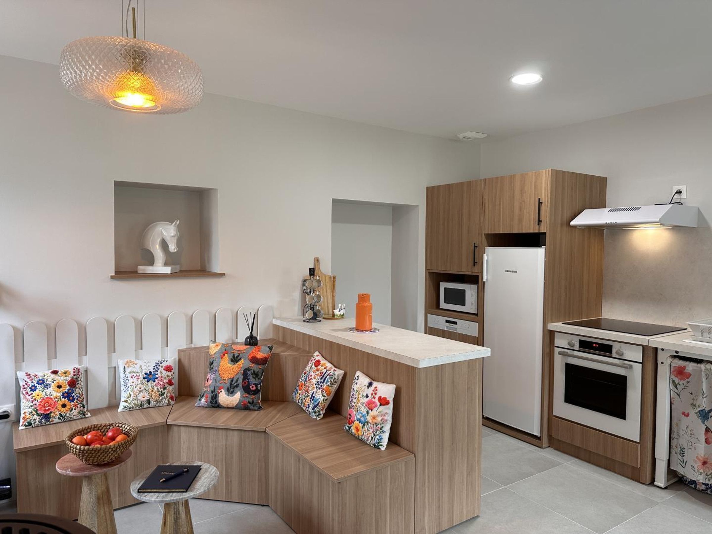 A modern kitchen with a built-in stove, microwave, and oven.