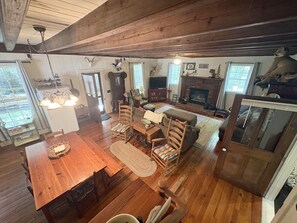 Great room with beams and dining table
