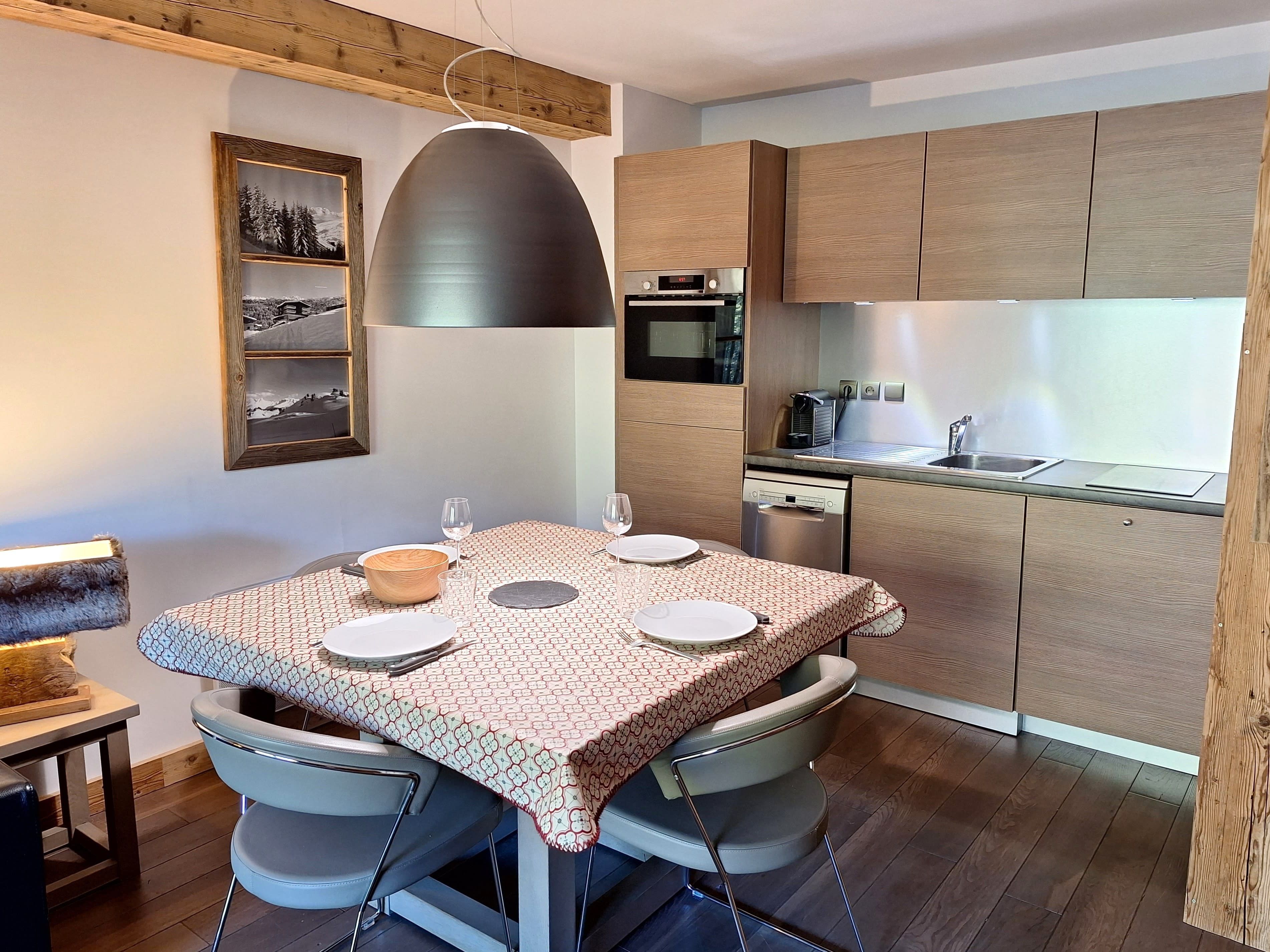 A modern kitchen with wooden cabinets, a built-in oven, and a dishwasher.
