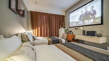 A hotel room with a bed, a desk, a television, and a large window with curtains.