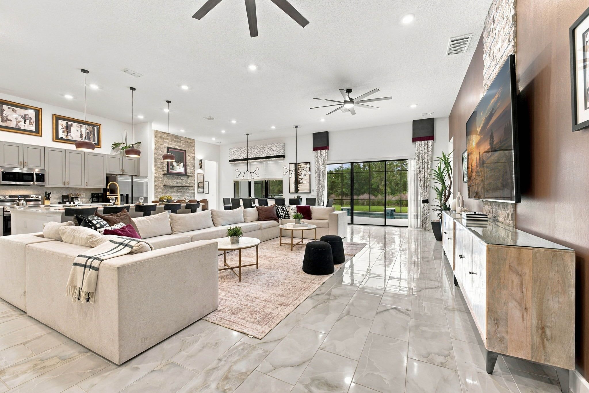 Chic and spacious living area integrating kitchen, dining and living rooms