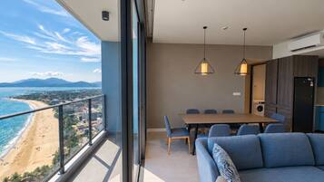 Modern beachfront condo with private balcony and panoramic ocean views