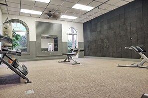 A gym with exercise equipment, large windows, and a view of the outdoors. - Cozy Stay near Disney w/Pool, Lazy River & Resort (Davenport)