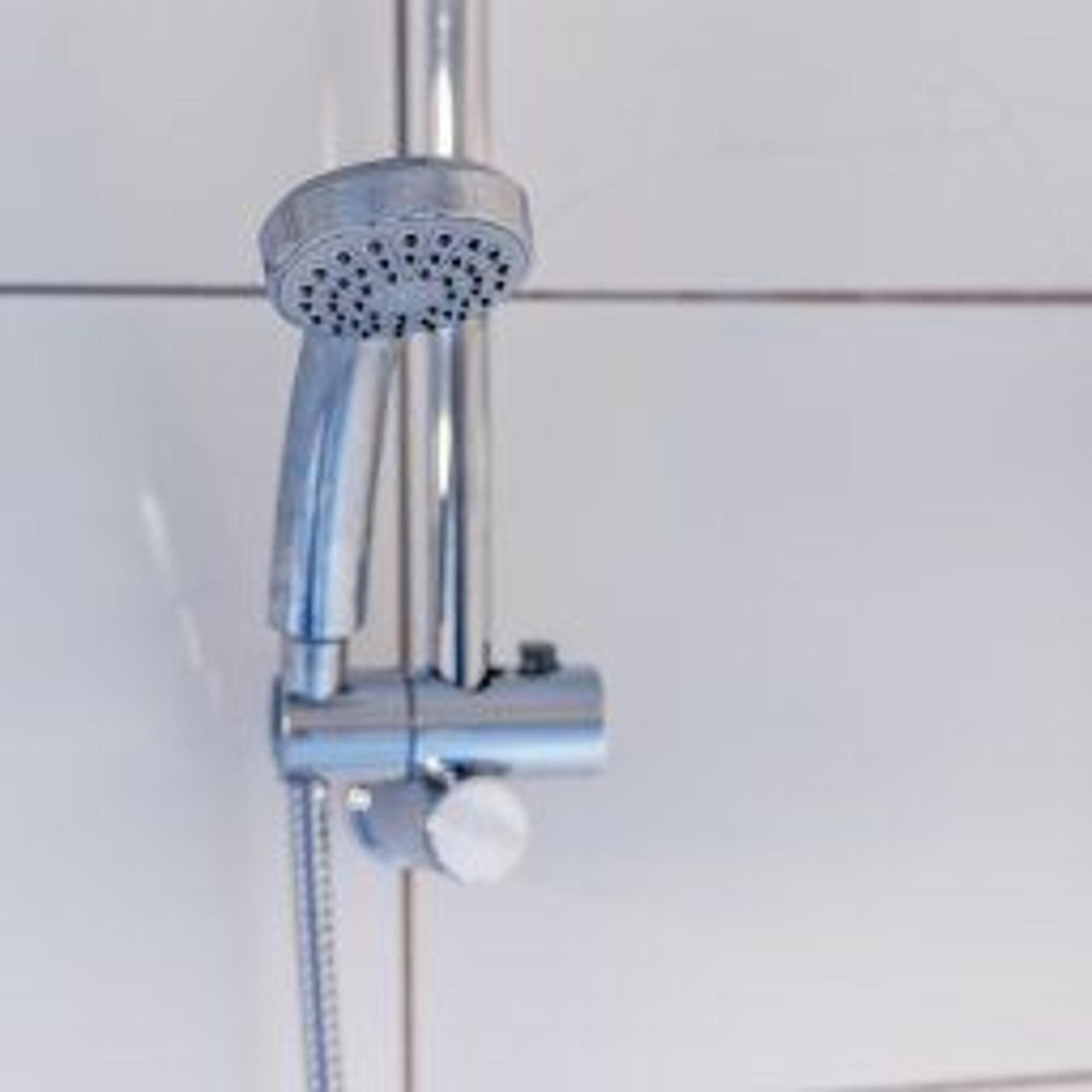 A showerhead with a handheld attachment, likely for a handheld shower.