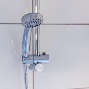 A showerhead with a handheld attachment, likely for a handheld shower. - Darlington Town Centre - Stay 5 - Central Location (Darlington)