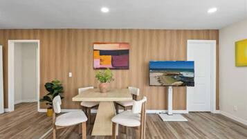 Enjoy meals and meaningful conversations in the chic and inviting dining area, featuring a stylish table with comfortable seating for guests.