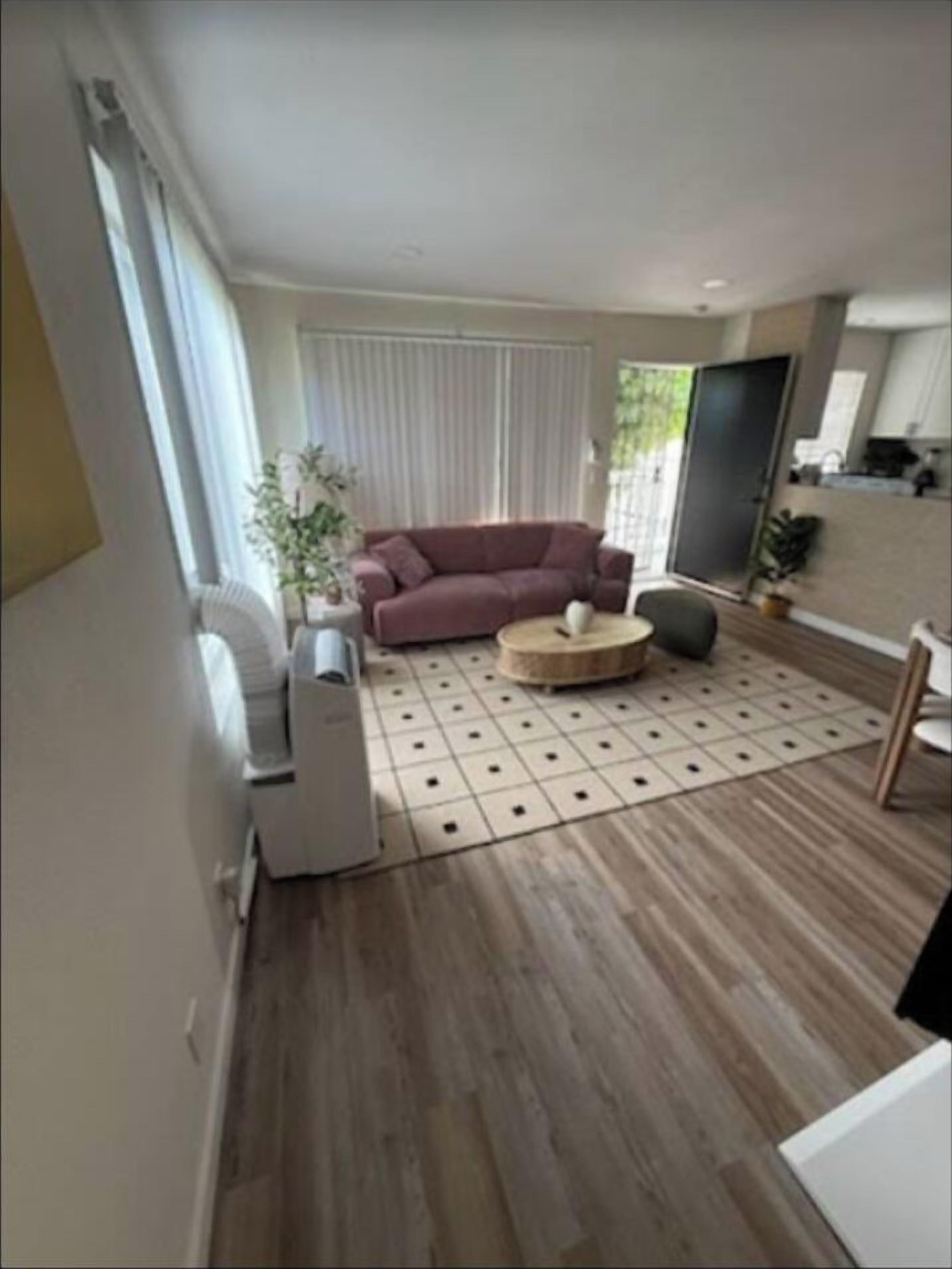 Unwind in the comfortable living room while enjoying your favorite shows and movies on the TV.