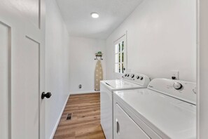 Bright, spacious laundry room with side-by-side washer and dryer - Luxury Spacious Columbia Stay | 3BR • 2BA (Columbia)