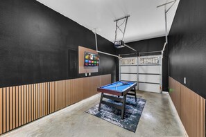 A billiards table in a room with a projector mounted on the ceiling. - Cozy 3BR - Walk to Fair Park - Pool Table, Fire Pit (Dallas)