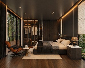 A modern bedroom with a large bed, a seating area, and a walk-in closet. - Private 1BR Mountain Cabin with Hot Tub & Views (Menlo)