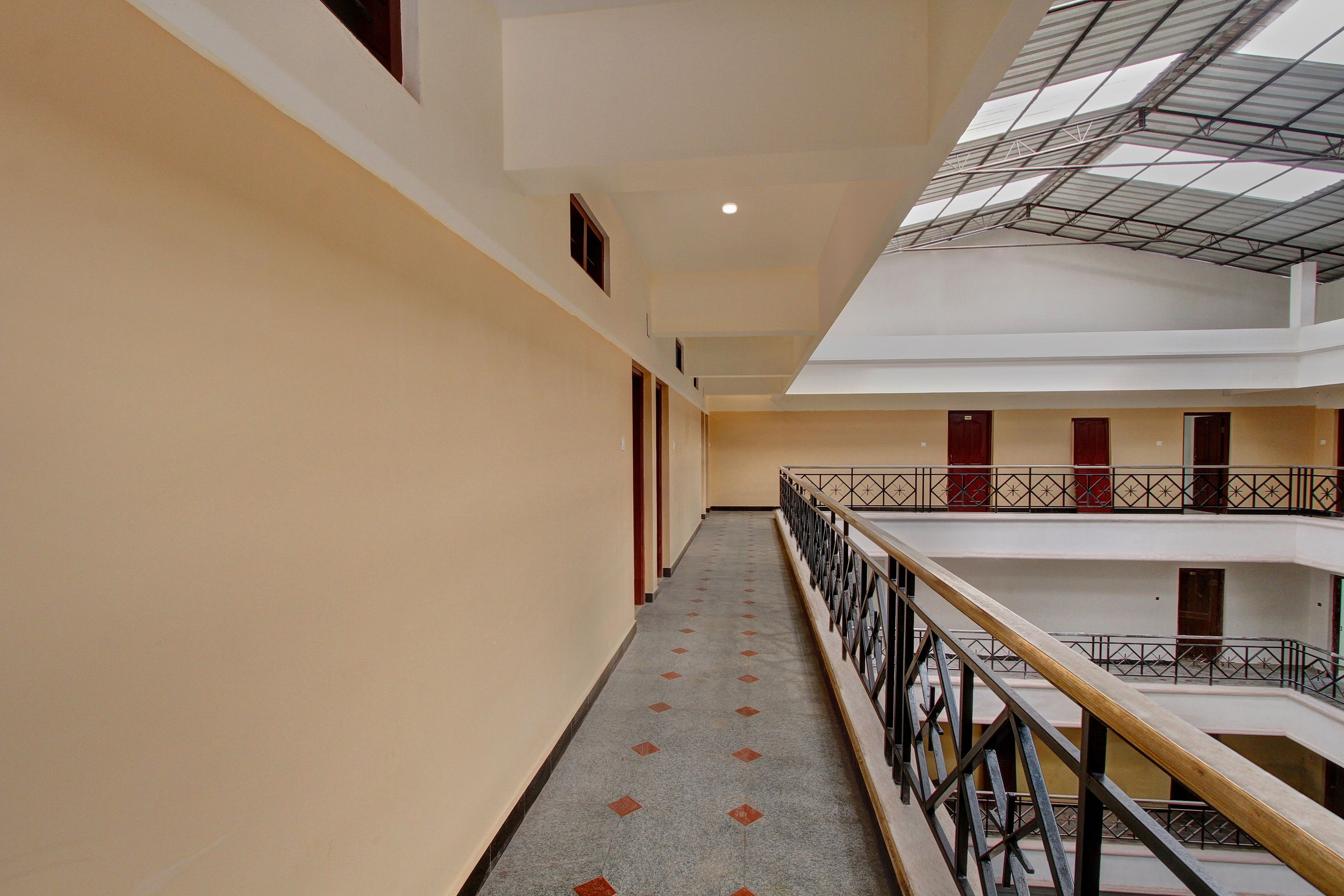 A multi-level corridor with a central staircase, connecting different floors.