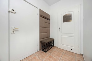 Bright hallway with modern entrance door. - Warsaw | Bukowińska 24A | Comfortable Apartment | Balcony and Parking (Warszawa)