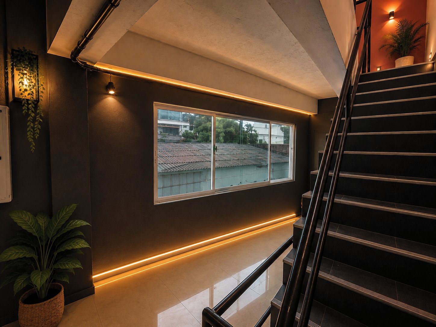 Un escalier moderne avec une rampe en verre et une vue sur un quartier résidentiel.