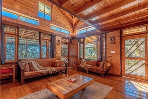 Living area - A pinewood retreat with a private sky deck amidst farms & orchards (South Gola Range)