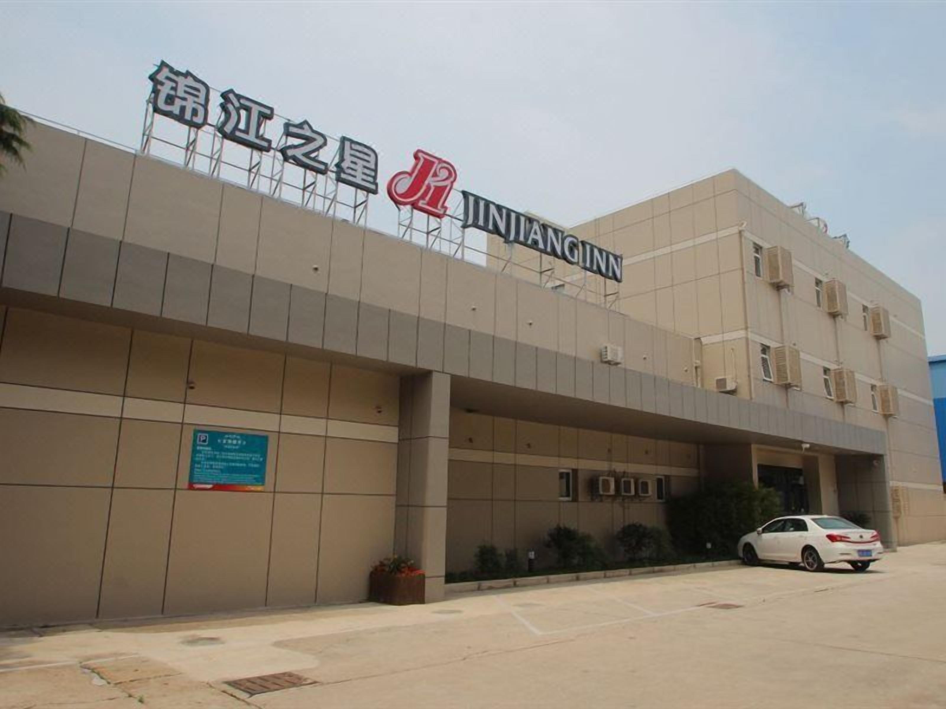A building with a sign reading 'Jinjiang Inn.'