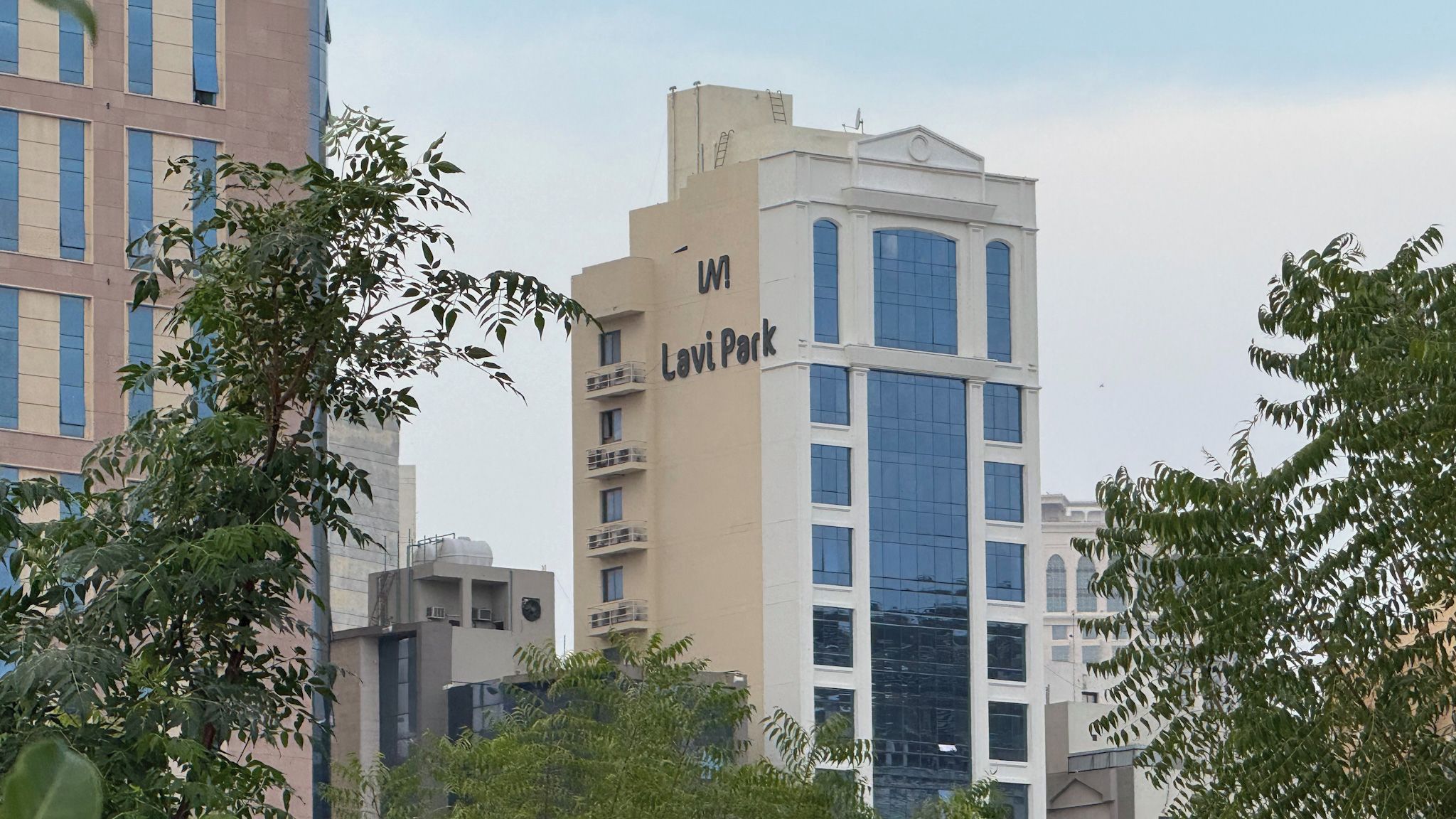A multi-story building with a prominent sign reading 'Lavi Park.'