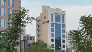 A multi-story building with a prominent sign reading 'Lavi Park.' - Lavi Park (Makkah)
