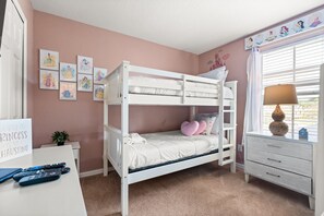 A bunk bed room with a desk, a dresser, and a window with blinds. - The Regal Escape W/ Lazy River | Near Disney (Davenport)