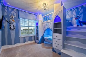 A child's bedroom with a snow-themed design, including a bed, built-in shelving, and wall decorations. - Windsor Island - 6336 (Davenport)