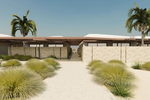 A modern building with a covered entrance, palm trees, and a sandy pathway. - Meerum 3 A Private Beachfront Sanctuary by Domisi (Pigianos Kampos)