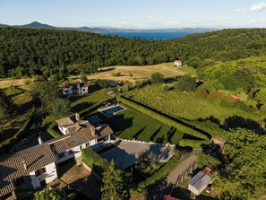 A large estate with multiple buildings, a swimming pool, and a view of the sea. - Villa with private pool, gym, games close to lake (Bracciano)