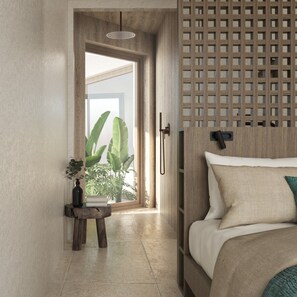 Un dormitorio con cama, cabecera de madera, una mesita con planta y vistas a través de una ventana.
